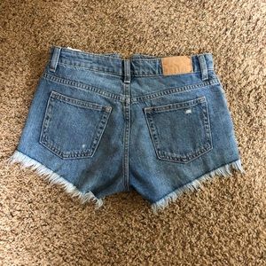 High waisted, ruffled shorts, light washed.